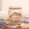 miel de myrtille 650g skarby roztocza cuillère carré face produit