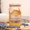 miel de myrtille 1000g récolte mai trésors de roztocze cuillère myrtilles front carré produit